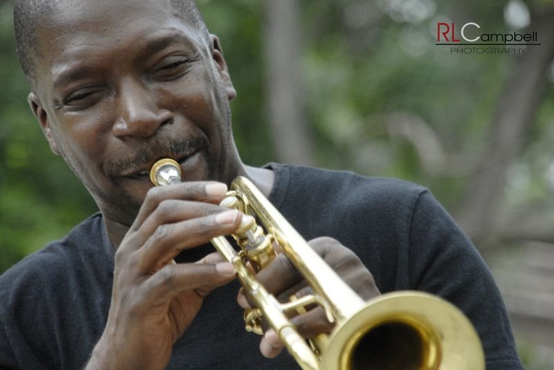 Close-up of Freddie Dunn playing trumpet outdoors